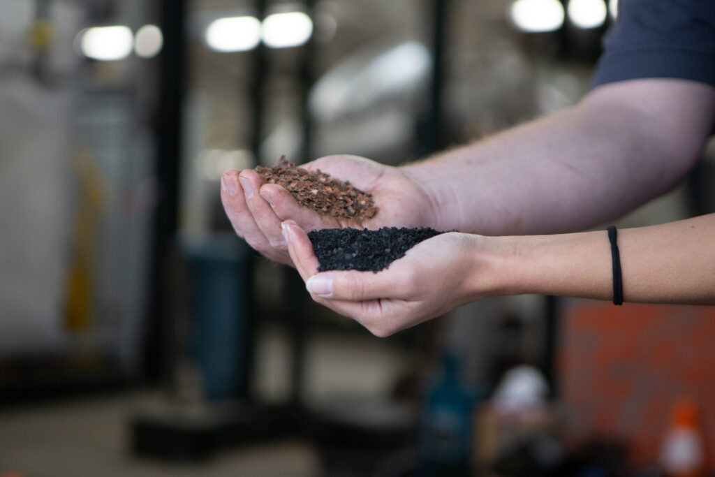 biochar and cocoa beans in hand